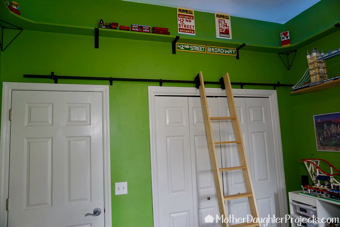 The ladder moves easily out of the way to access both the room door and closet doors. 