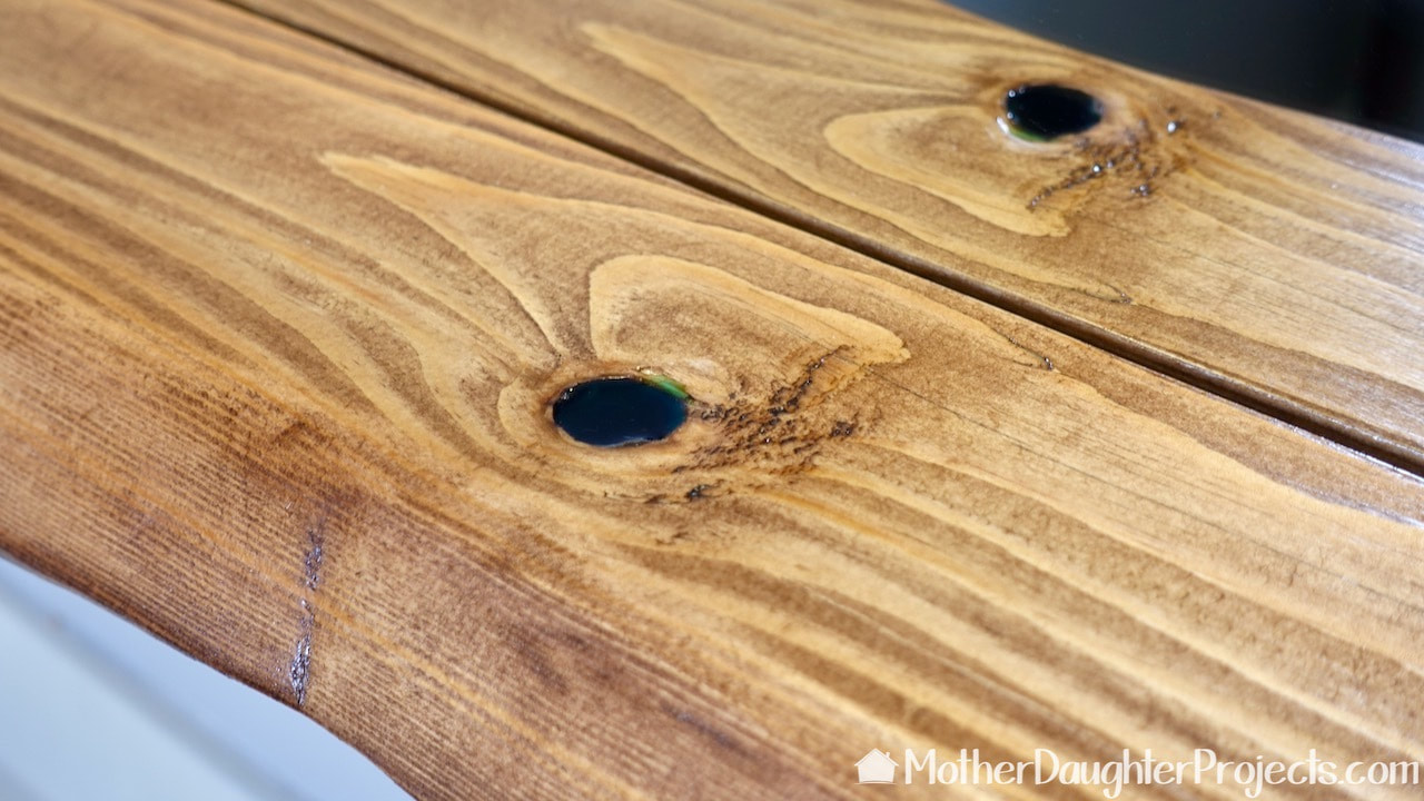 Two knot holes on the shelf went all the way through the board. Off camera we filled them with TotalBoat epoxy.