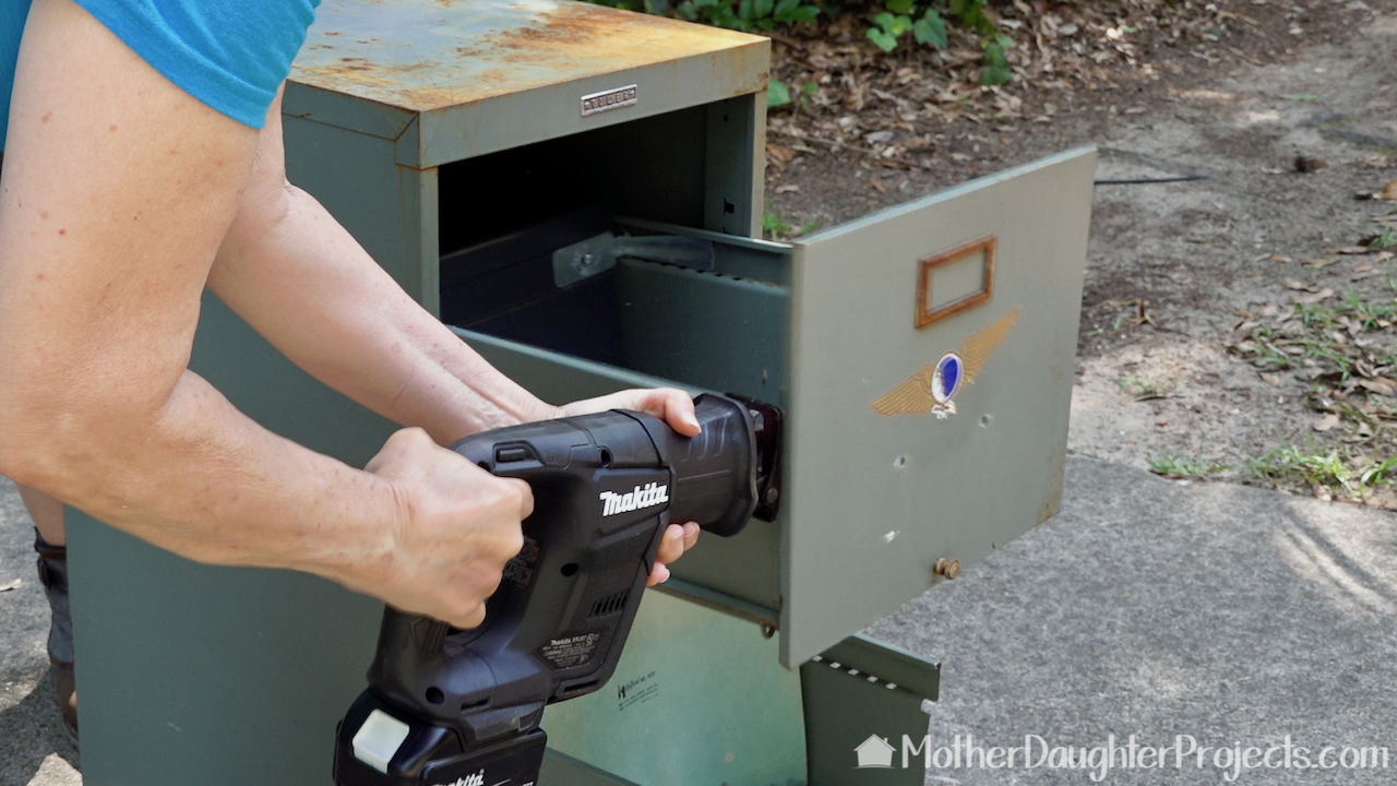 The Makita subcompact reciprocating saw with Diablo blade easily cutting through the metal file cabinet. 