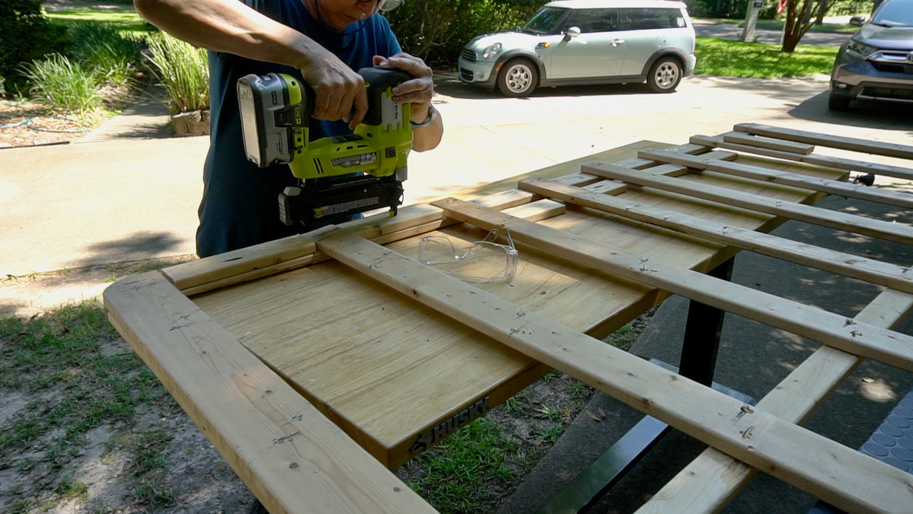Adding support pieces to the sides of the new bed frame base.