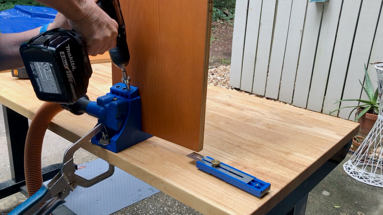 Using a Kreg Pocket Hole jig in the shelving sides of the bed frame.