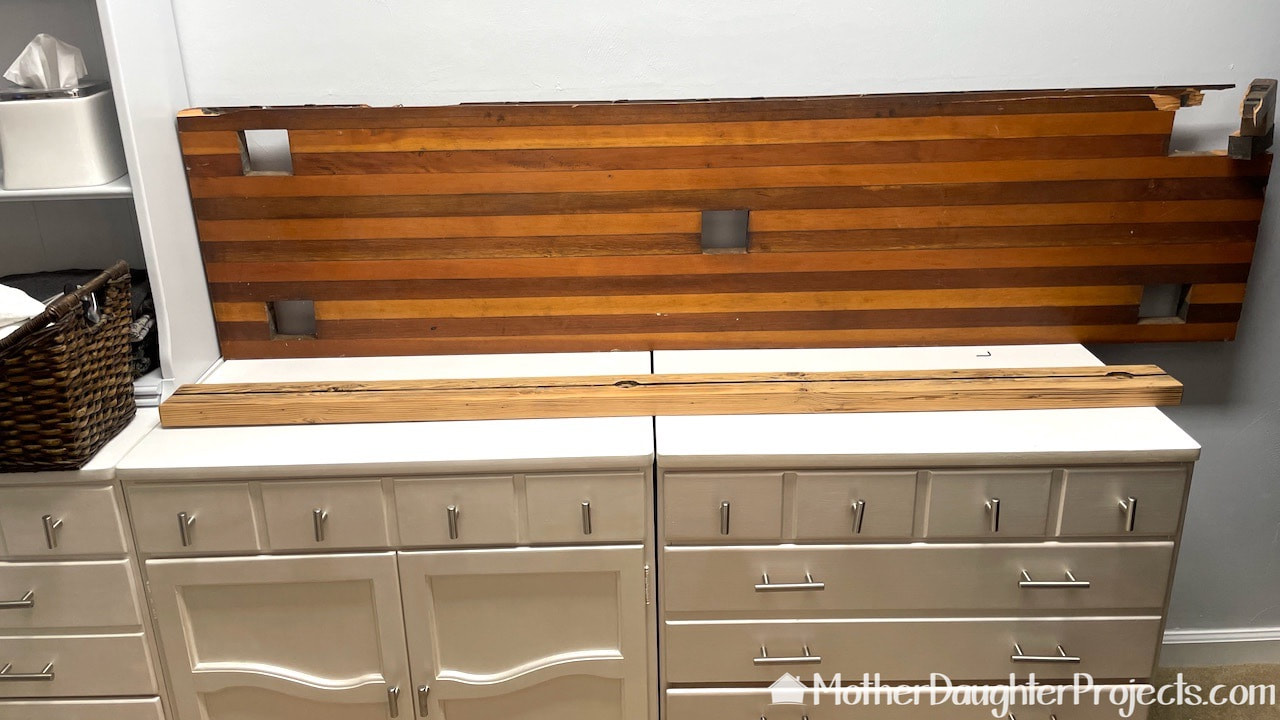Upcycling a piece of wood into a warm natural backsplash in the master closet.
