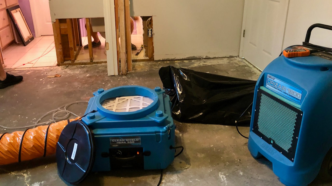 Silver Lining brought in a dehumidifier and a HEPA filter to help dry out the room and capture any airborne mold spores.