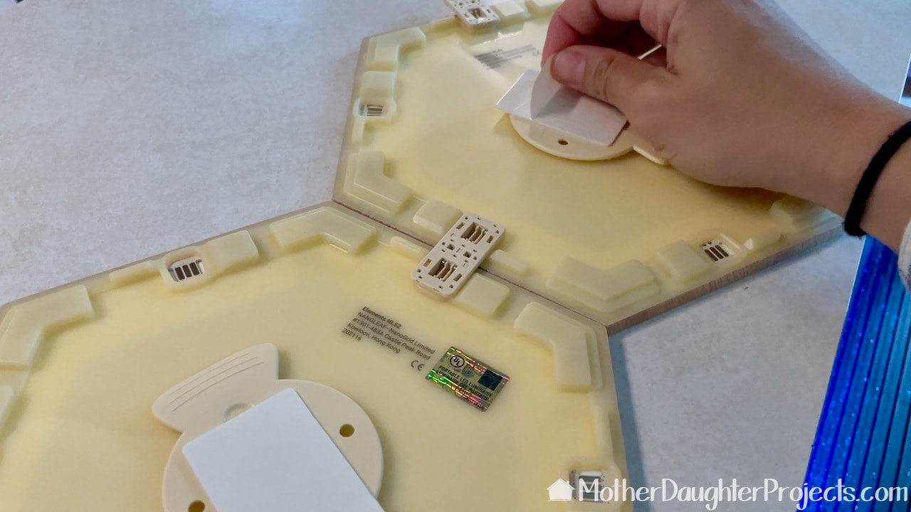 Attaching the Nanoleaf panels with connectors.