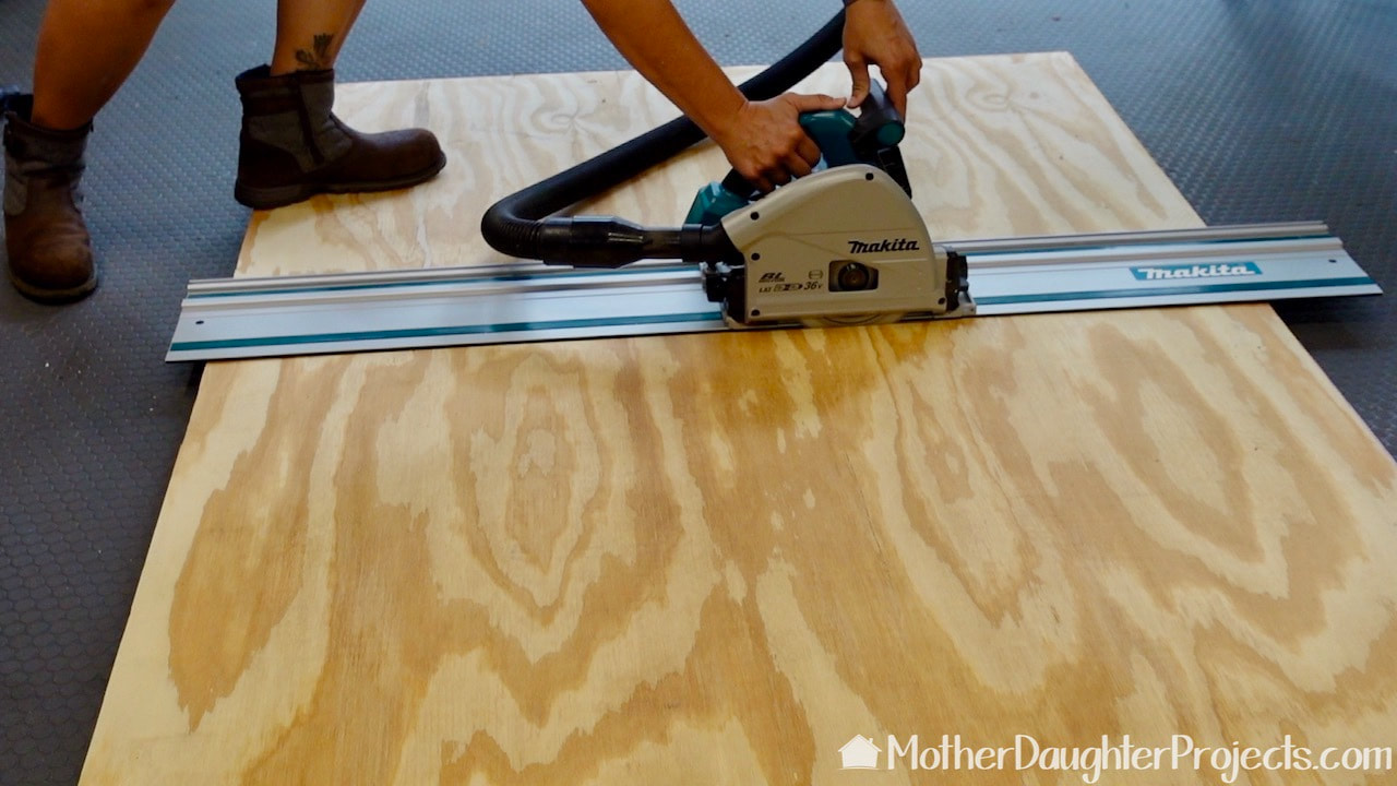 Cutting the plywood with a Makita track saw from the Home Depot.
