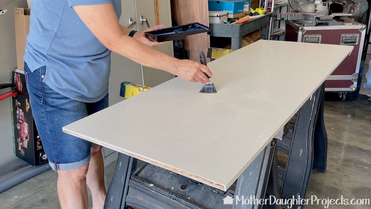 The shelves were painted with white paint and finished with a clear coat of polyurethane.