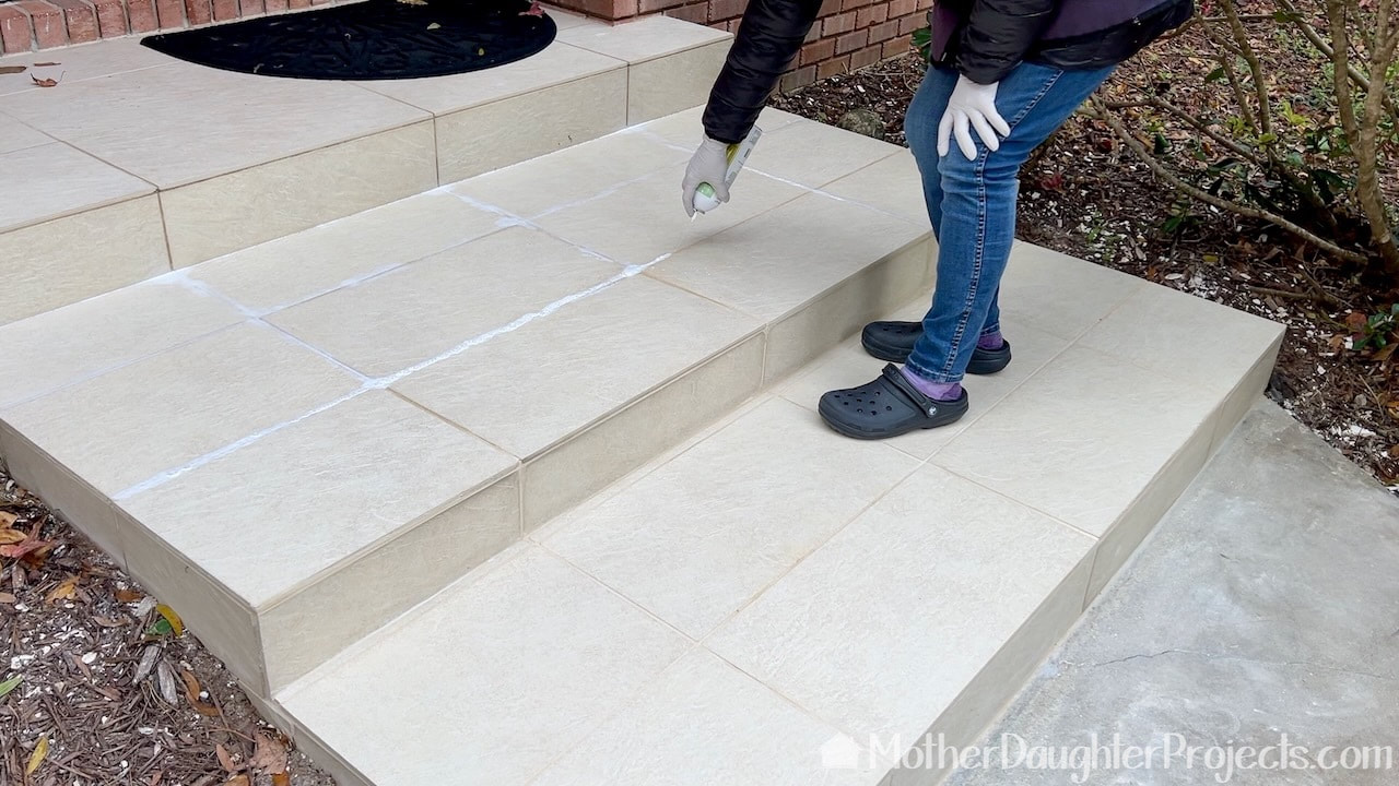 Sealing the grout with grout sealer.