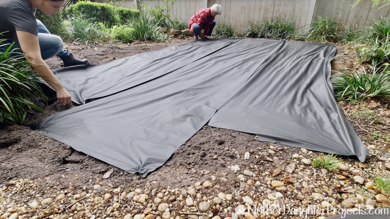 Covering the area with landscape fabric prior to adding the pea gravel.