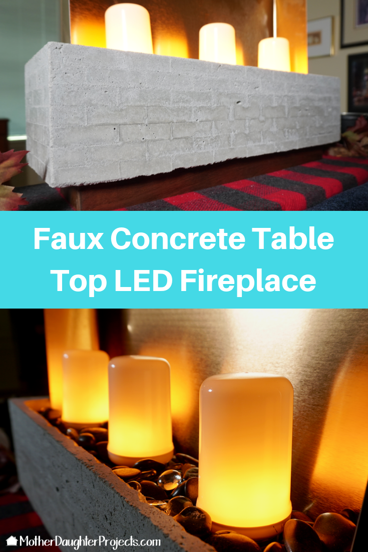 Video tutorial! Learn how to made a small concrete fireplace with a bathroom fixture and LED fire effect bulbs! #concrete #fire #led #diy #effect 