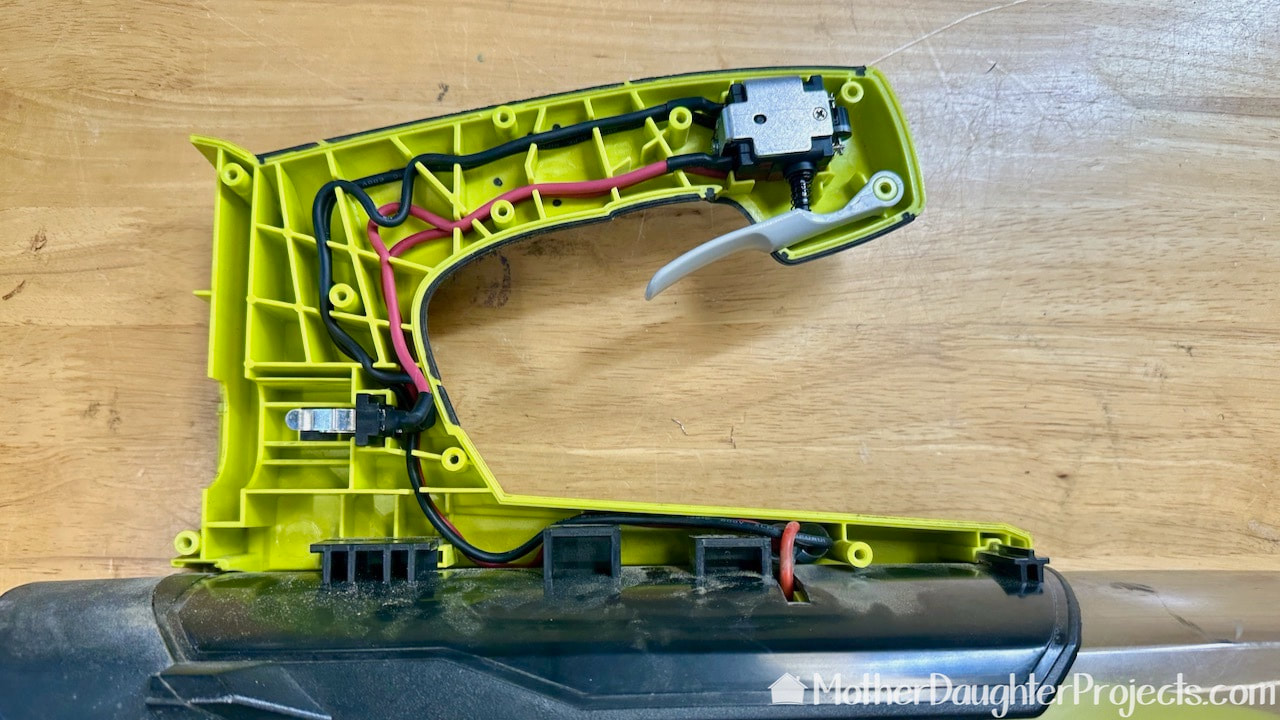 Push the wiring into the channels in the handle of the ryobi leaf blower. The fix is almost done!