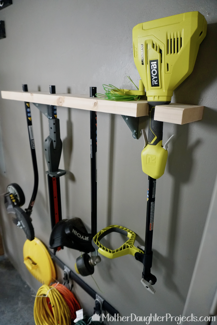 Video tutorial! Learn how to store the ryobi expand-it outdoor tools and see them in use! #storage #stringtrimmer #hedgetrimmer #edger