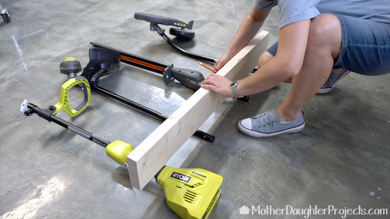 Measuring the length of the Ryobi Expand-it System holder. 