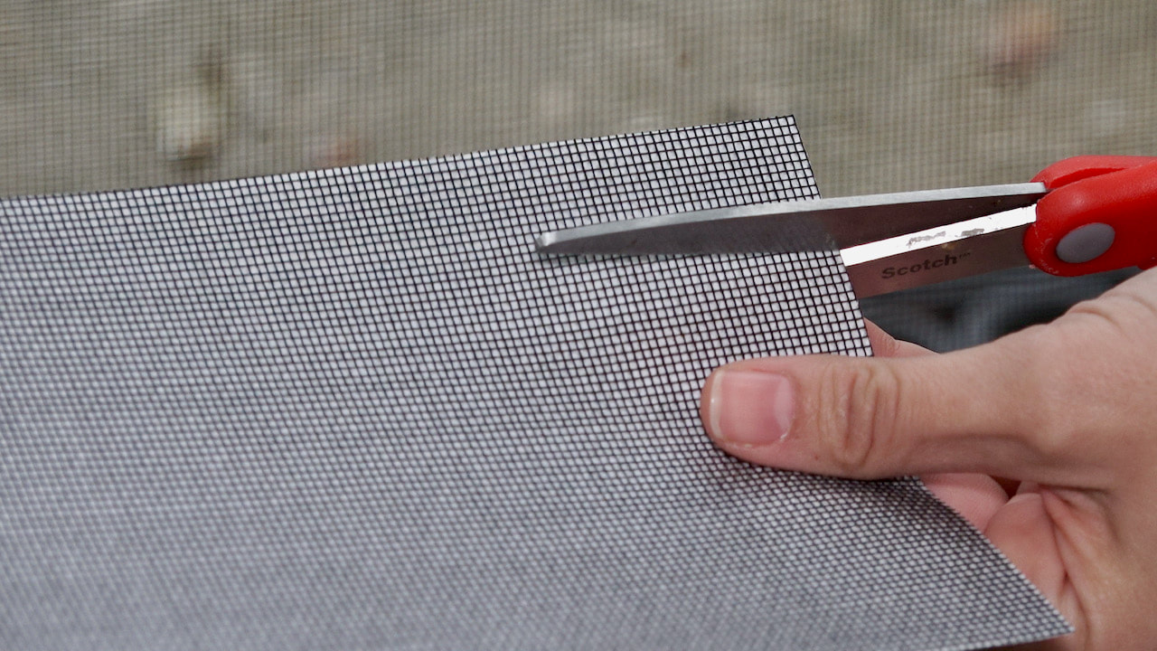 Cutting the ScreenMend to the right size.