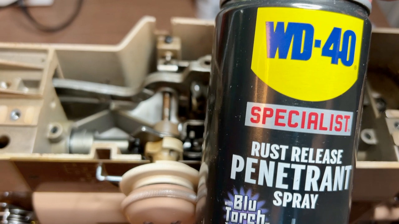 Unsticking the selector knobs on the singer with WD-4- specialist rust release penetrant spray.