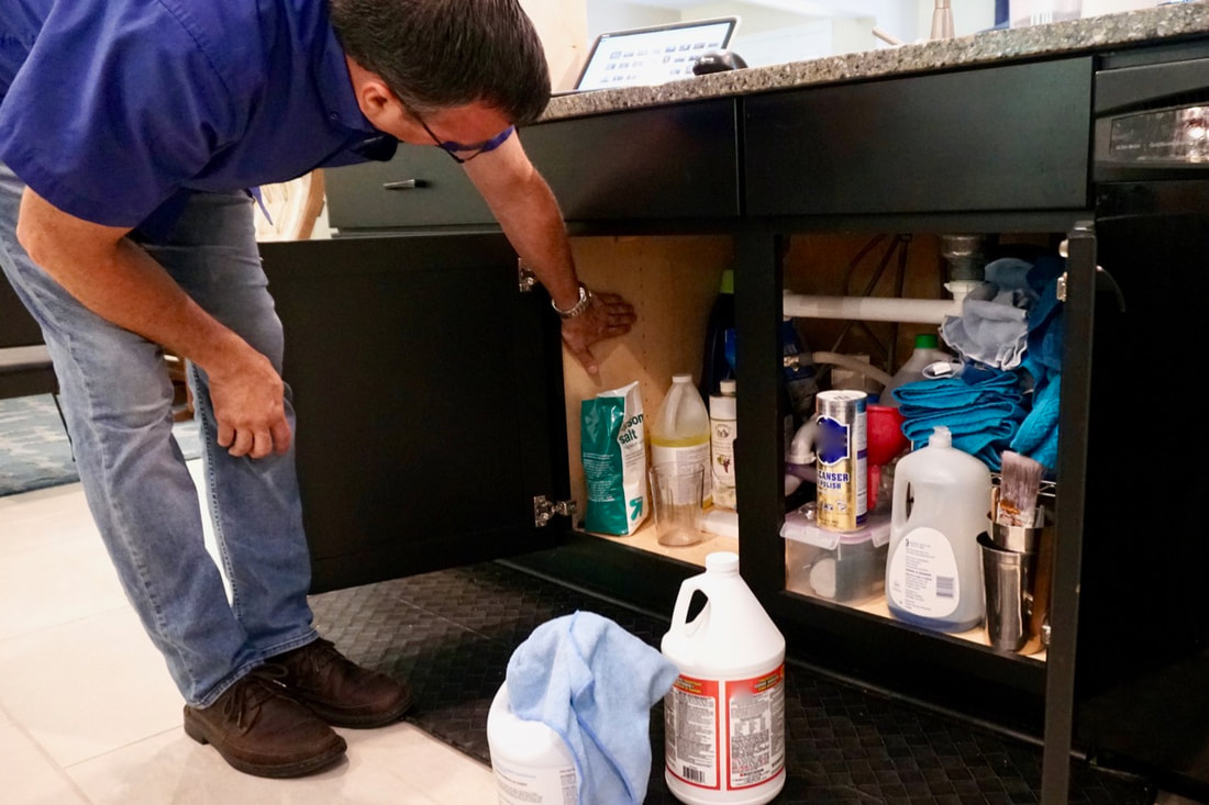 Under the sink can benefit from ShelfGenie glide-outs.