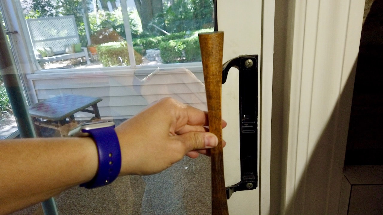 Testing the sliding glass door handle to see if the Locktite Threadlocker worked. 