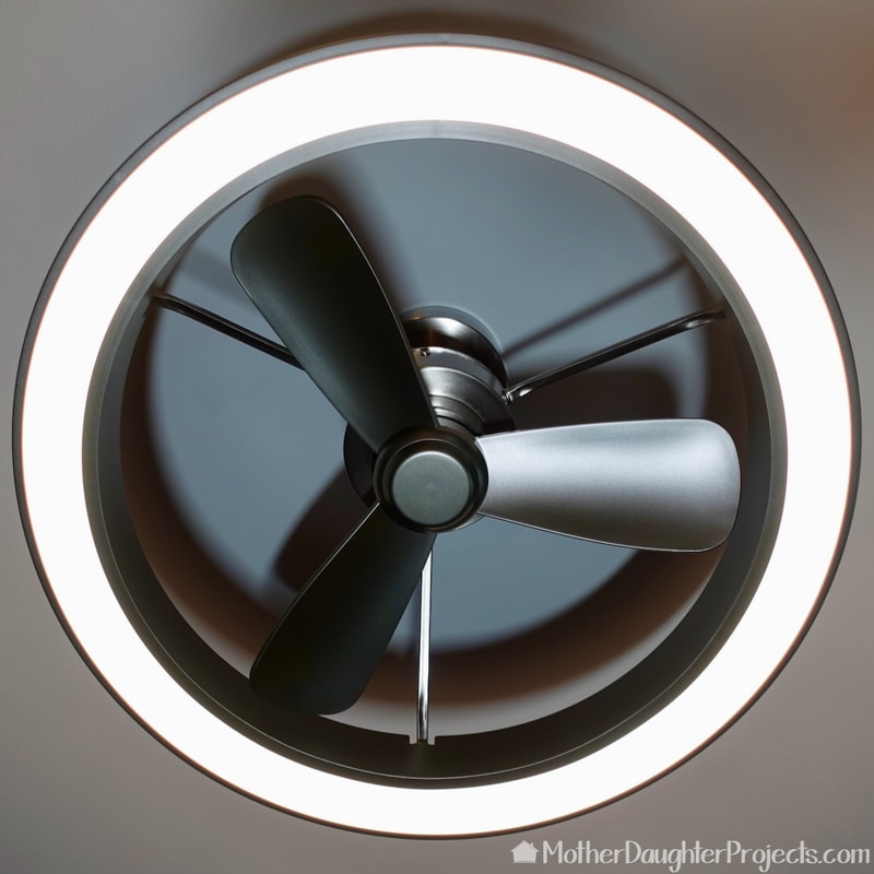 The underside of the Artika Edwin installed ceiling fan with integrated LED lighting. 