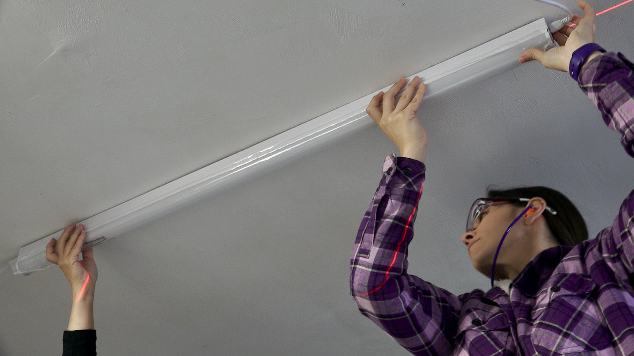 Adding the first fixture to the ceiling. 