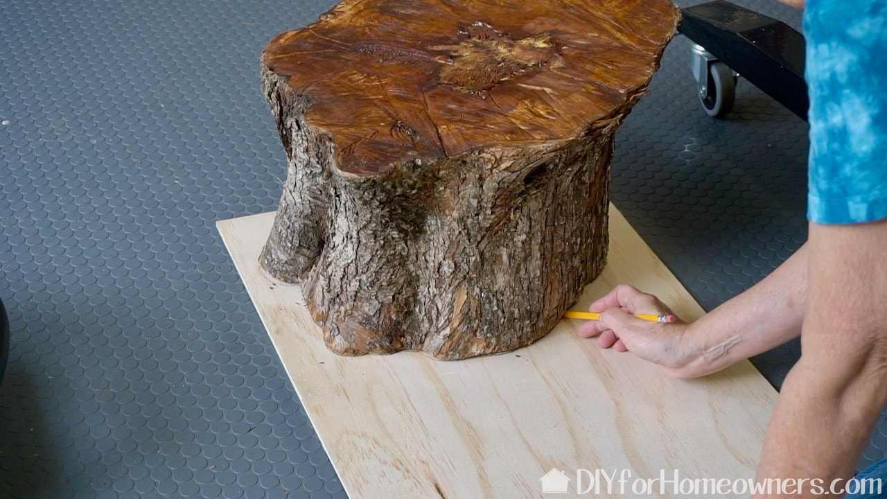 Tracing around the stump top to make the base for the cushioned seat.