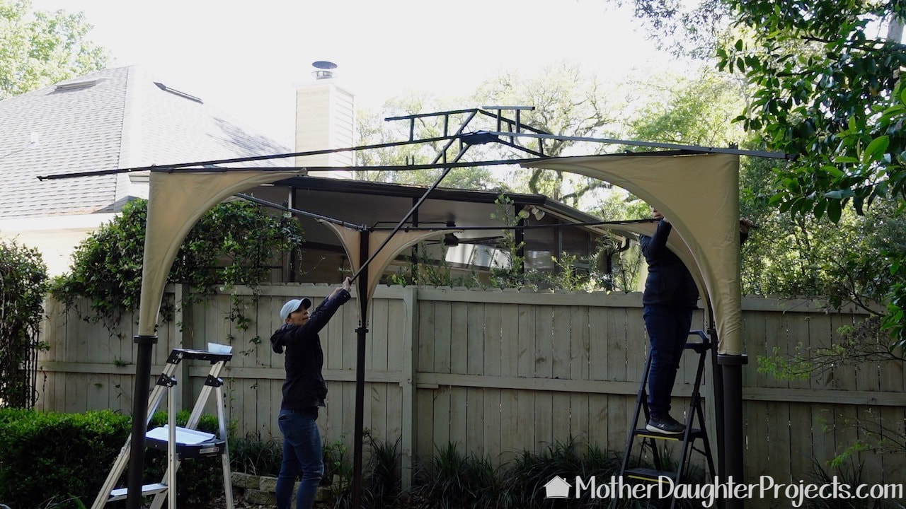 adding the canopy support as we continue the assembly of the Sunjoy outdoor gazebo.