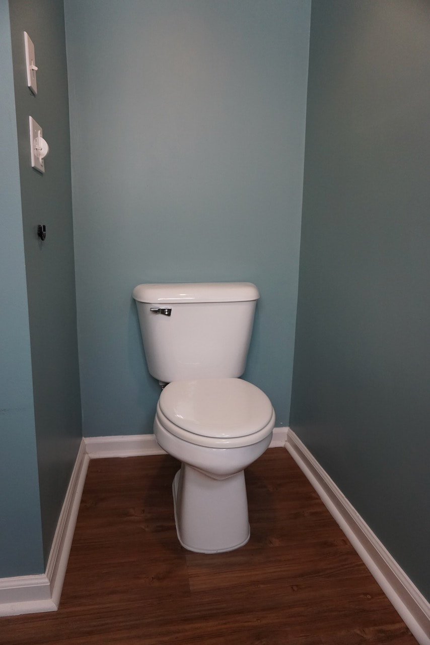 Here's the space with the old toilet and lack of decor.