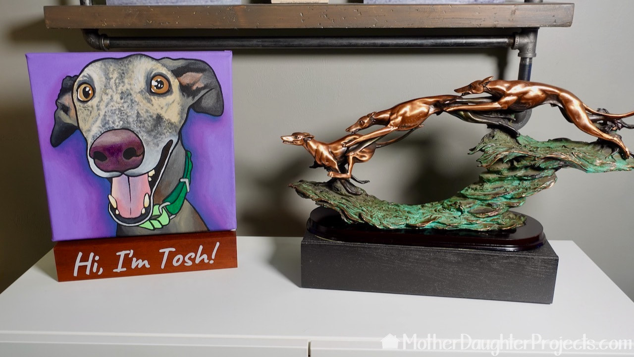 The new box functions as a pedestal for the greyhound statue. 