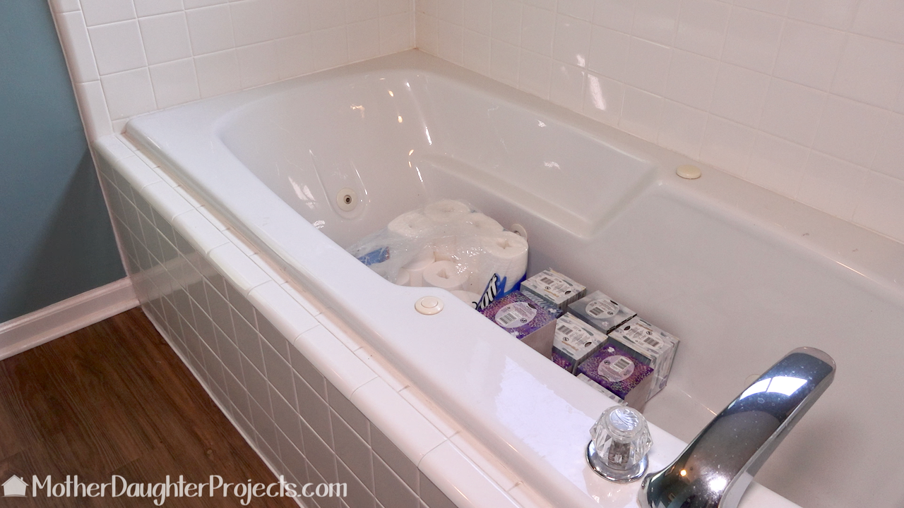The tub is a perfect place to store bathroom essentials.