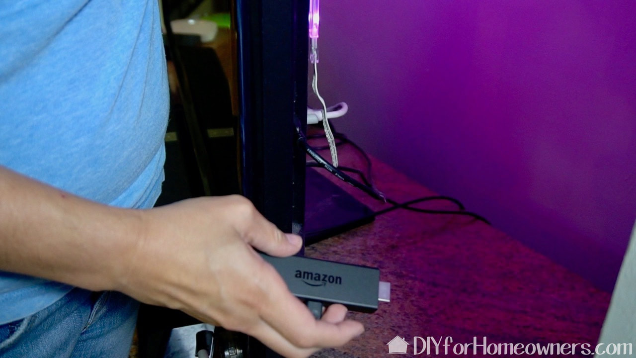 Insert the Amazon Fire TV stick into an empty HDMI port on the TV.