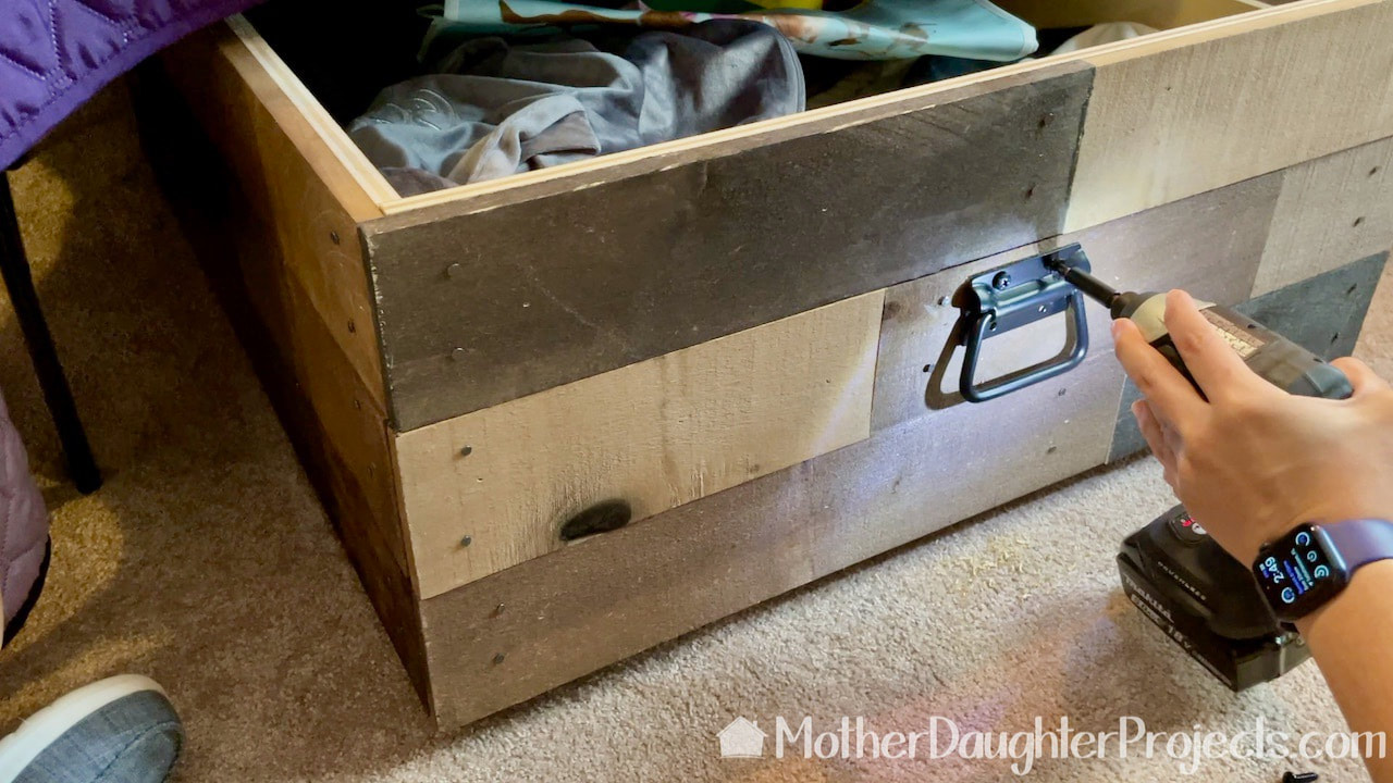 Adding handles to each end of the under bed sliding storage boxes.