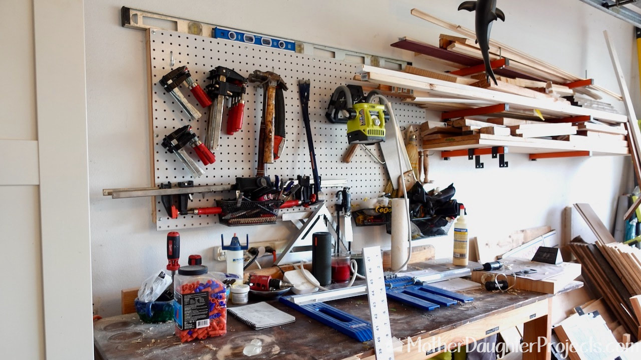 We are ready to replace the old wood pegboard with metal Wall Control pegboard.