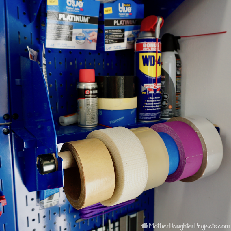 Wall Control paper towel holder for tape storage. 