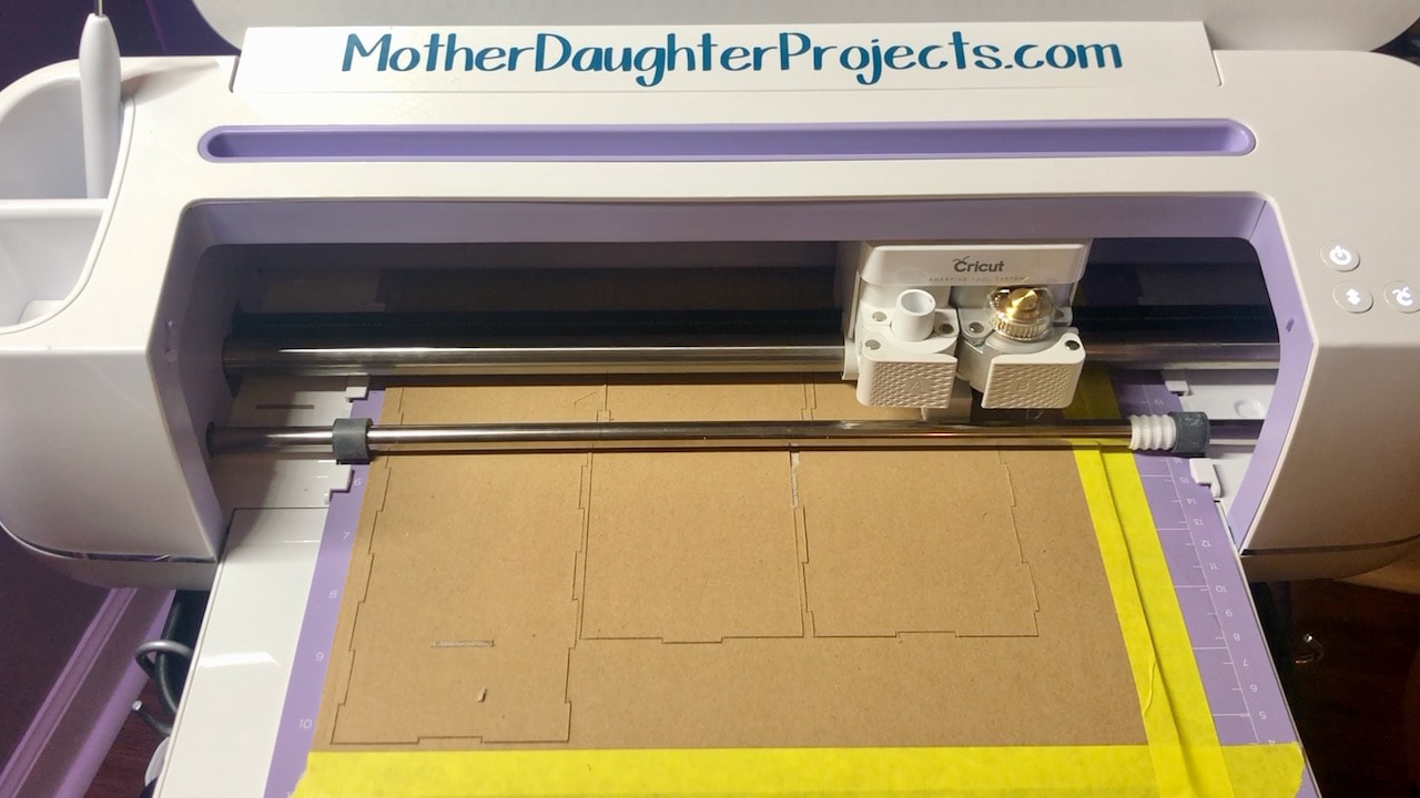 With the Cricut Maker knife blade inserted into the machine, you can cut chipboard