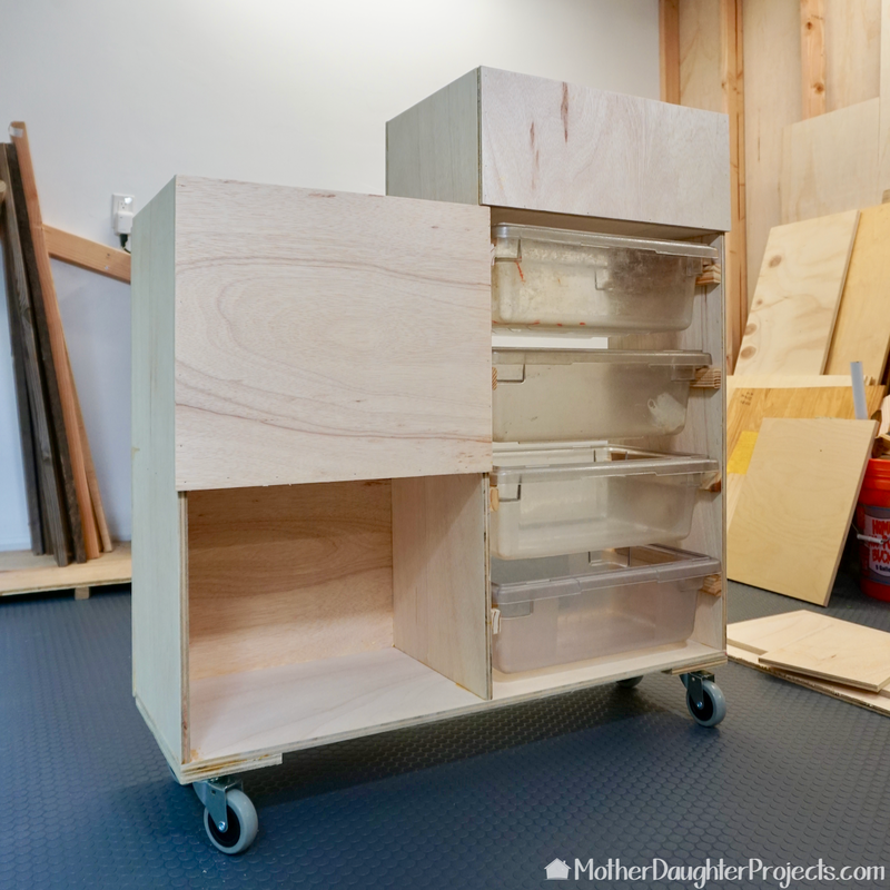 Restaurant heavy duty bins serve as wood storage drawers. 