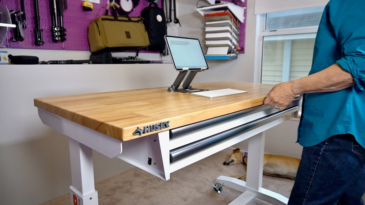 52 in. Adjustable Height Work Table with 2-Drawers in White in Steph's office.