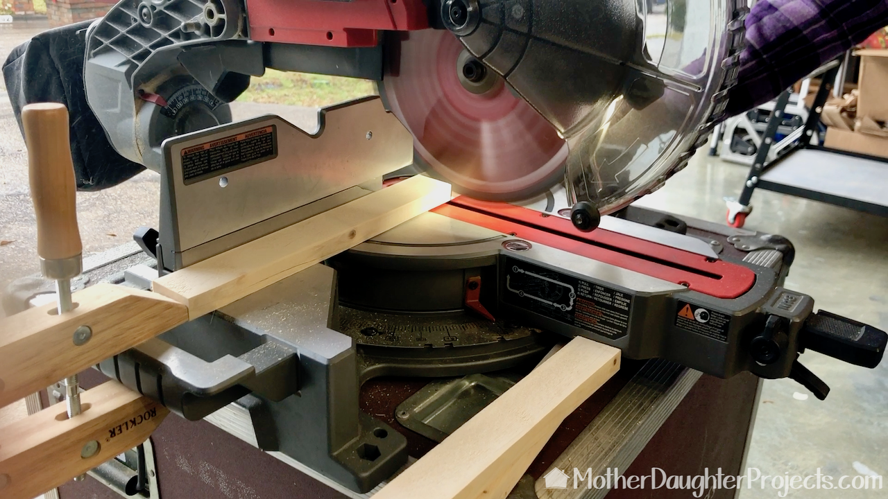 Using the Milwaukee miter saw with a stop block in place.