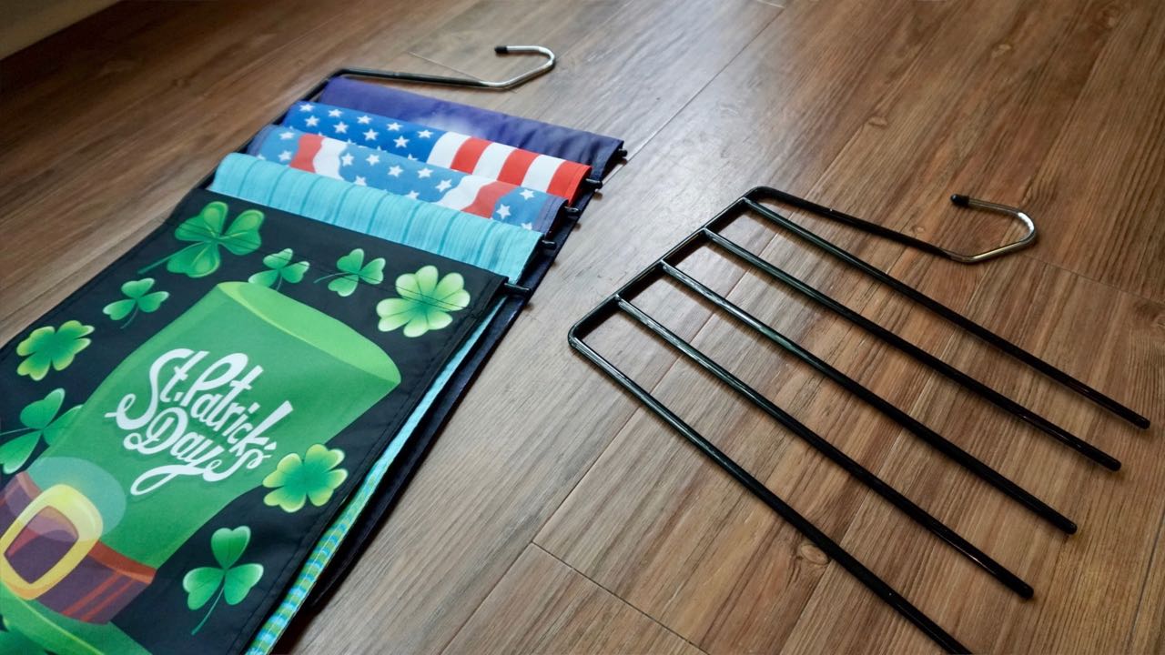 Store your garden flags on pant hanger. 