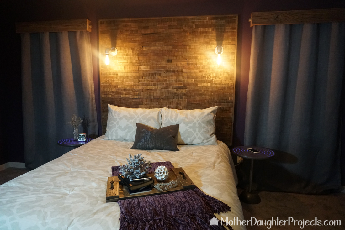See how to use peel and stick wood tile to make a rustic/ industrial headboard. Mix pallet board and metal/steel pipes for this great bedroom decor! 