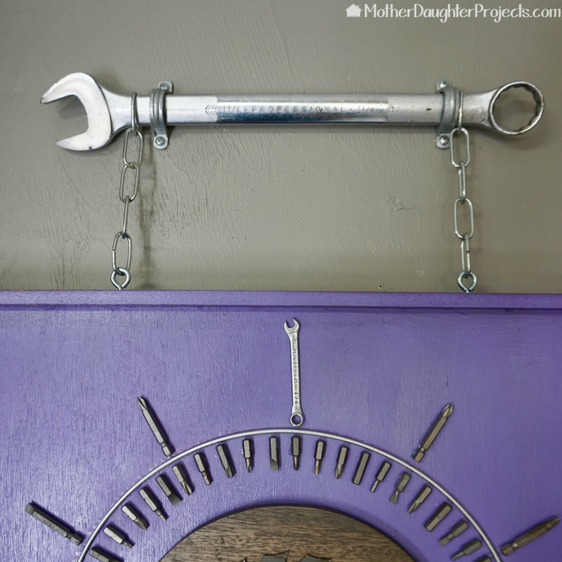 Learn how to use old driver bits, wrenches, saw blades, and more to make a shop clock perfect for a garage!